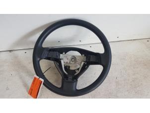 Used Steering wheel Daihatsu Cuore (L251/271/276) 1.0 12V DVVT Price € 25,00 Margin scheme offered by Autodemontagebedrijf Smit