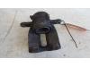 Front brake calliper, left from a Renault Clio III (BR/CR) 1.2 16V 75 2008