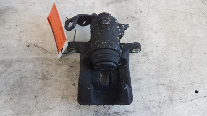 Rear brake calliper, left from a Skoda Fabia II (5J) 1.2 TDI 12V Greenline 2012