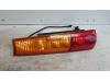 Taillight, left from a Suzuki New Ignis (MH), 2003 / 2007 1.3 16V, Hatchback, 4-dr, Petrol, 1.328cc, 69kW (94pk), FWD, M13AVVT, 2003-09 / 2007-12, MHX51 2004