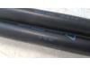 Set of tailgate gas struts from a Opel Corsa D 1.2 16V 2008
