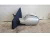 Wing mirror, left from a Renault Clio III (BR/CR) 1.4 16V 2006