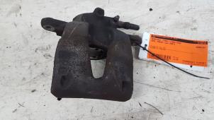 Used Front brake calliper, left Opel Corsa D 1.2 16V Price € 10,00 Margin scheme offered by Autodemontagebedrijf Smit