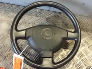Used Steering wheel Daihatsu Cuore (L251/271/276) 1.0 12V DVVT Price € 80,00 Margin scheme offered by Autodemontagebedrijf Smit