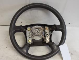 Used Steering wheel Mazda Demio (DW) 1.3 16V Price € 40,00 Margin scheme offered by Autodemontagebedrijf Smit