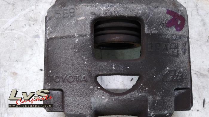 Front brake calliper, right from a Toyota Yaris III (P13) 1.33 16V Dual VVT-I 2012