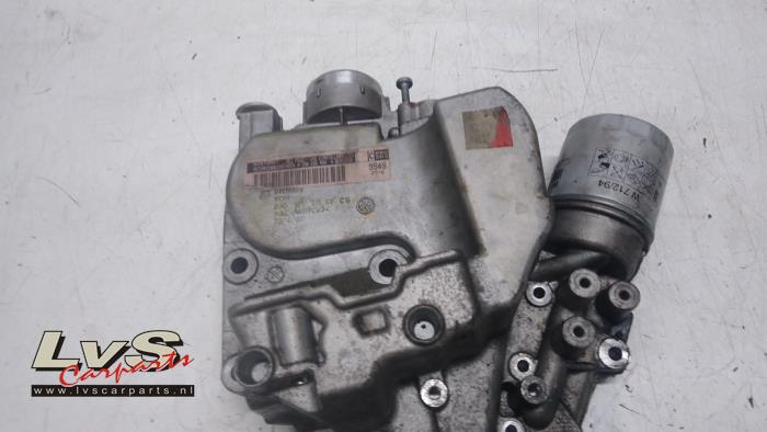 Timing cover from a Volkswagen Scirocco (137/13AD) 1.4 TSI 122 16V 2010