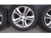 Set of wheels + tyres from a Peugeot 208 I (CA/CC/CK/CL) 1.4 16V 2012