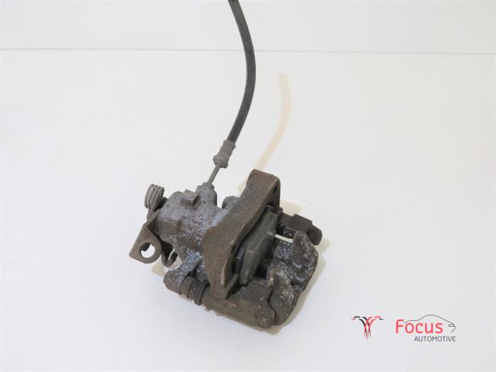 Rear brake calliper, left from a Peugeot 208 I (CA/CC/CK/CL) 1.4 16V 2012