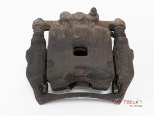 Used Front brake calliper, left Ford Fiesta 6 (JA8) 1.6 TDCi 16V 95 Price € 12,99 Margin scheme offered by Focus Automotive