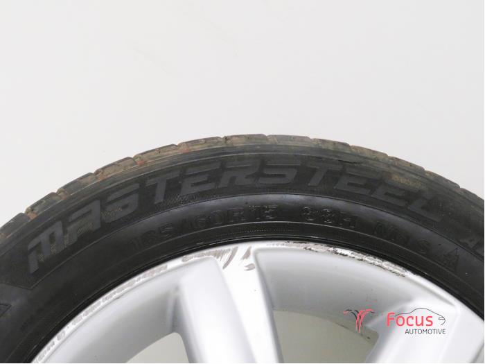 Wheel + winter tyre from a Volkswagen Polo V (6R) 1.2 TDI 12V BlueMotion 2012
