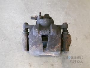 Used Front brake calliper, right Toyota Yaris (P1) 1.3 16V VVT-i Price € 15,00 Margin scheme offered by Autodemontage Veenendaal BV