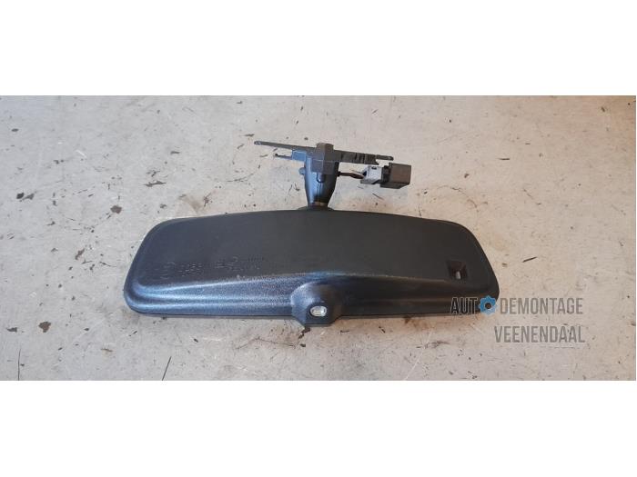 Rear view mirror from a Opel Corsa D 1.4 16V Twinport 2008