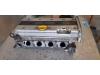 Cylinder head from a Opel Frontera (6B) 2.2i 16V 2003