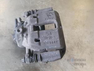 Used Front brake calliper, left Mitsubishi Colt 1.1 12V Price € 10,00 Margin scheme offered by Autodemontage Veenendaal BV