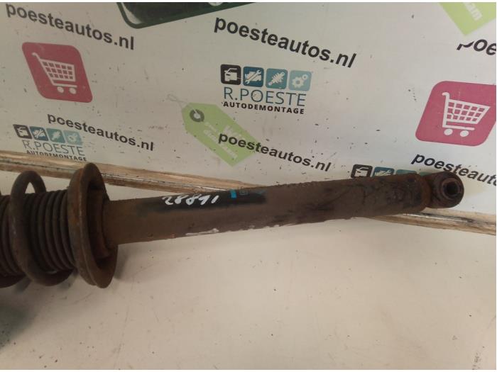 Rear shock absorber rod, left from a Renault Twingo (C06) 1.2 16V 2003