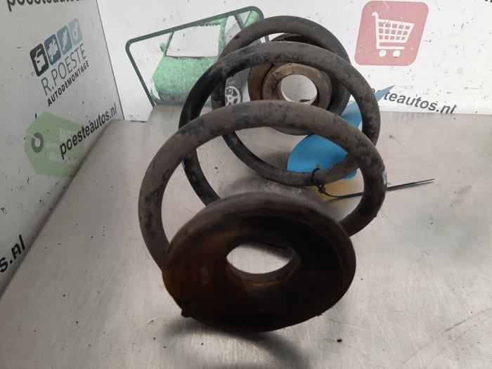 Rear coil spring from a Renault Twingo II (CN) 1.2 2008