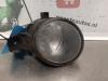 Fog light, front left from a Renault Clio III (BR/CR) 1.5 dCi FAP 2011