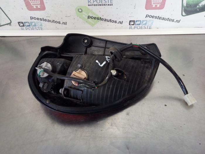 Taillight, left from a Daihatsu Sirion/Storia (M1) 1.0 12V 1999