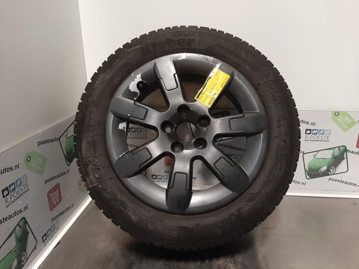 Wheel + winter tyre from a Volkswagen Polo V (6R) 1.2 TDI 12V BlueMotion 2010