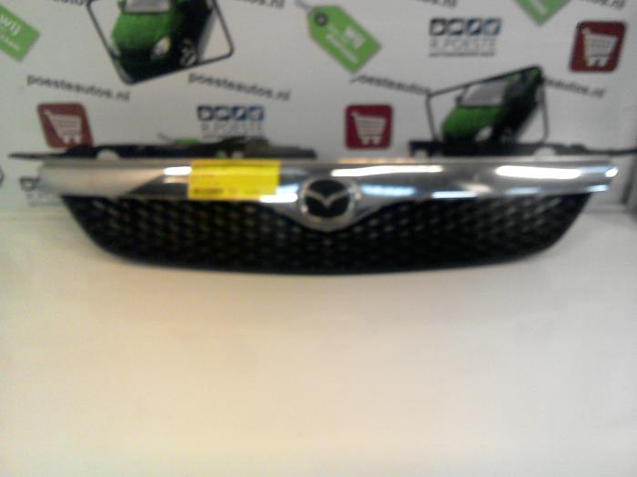 Używane Grill Mazda 323 Fastbreak (BJ14) 2.0 DTiD 16V Cena € 25,00 Procedura marży oferowane przez Autodemontagebedrijf R. Poeste B.V.