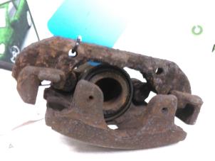 Used Front brake calliper, left Ford Fiesta 4 1.25 16V Price € 25,00 Margin scheme offered by Autodemontagebedrijf R. Poeste B.V.