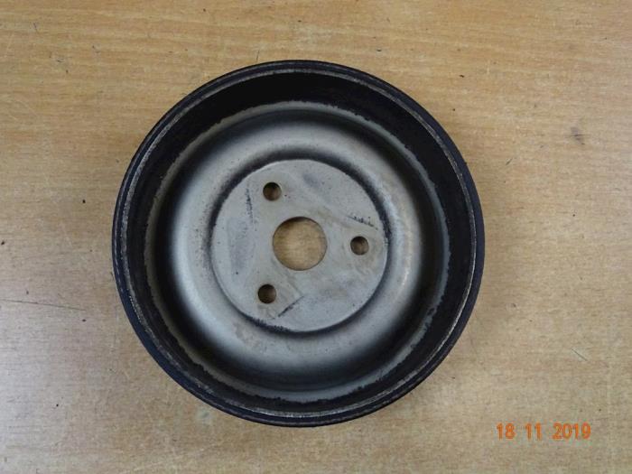 Water pump pulley from a MINI Mini (R56) 1.4 16V One 2008