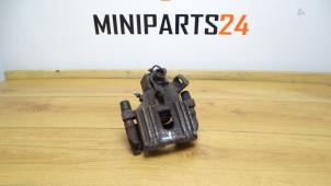 Used Rear brake calliperholder, left BMW Mini One/Cooper (R50) 1.6 16V One Price € 47,60 Inclusive VAT offered by Miniparts24 - Miniteile24 GbR