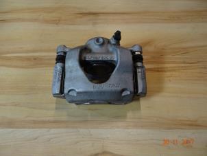 Used Front brake calliperholder, left Mini Cooper Price € 125,00 Margin scheme offered by Miniparts24 - Miniteile24 GbR