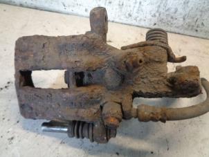 Used Rear brake calliper, left Nissan Almera (N16) 1.5 16V Price € 35,00 Margin scheme offered by Hans Auto Onderdelen