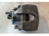 Front brake calliper, left from a Ford Focus 2 Wagon 1.6 TDCi 16V 110 2007
