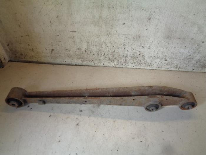 Rear wishbone, left from a Nissan Pixo (D31S) 1.0 12V 2010