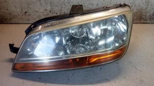 Used Headlight, left Fiat Idea (350AX) 1.4 16V Price € 40,00 Margin scheme offered by Hans Auto Onderdelen