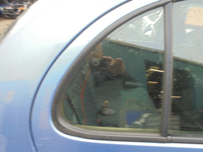 Usados Ventanilla triangular derecha detrás Nissan Micra (K12) 1.2 16V Precio € 25,00 Norma de margen ofrecido por Hans Auto Onderdelen