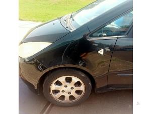 Used Front wing, left Mitsubishi Colt (Z2/Z3) 1.3 16V Price € 40,00 Margin scheme offered by Hans Auto Onderdelen