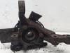 Knuckle, front left from a Opel Astra H SW (L35) 1.8 16V 2006