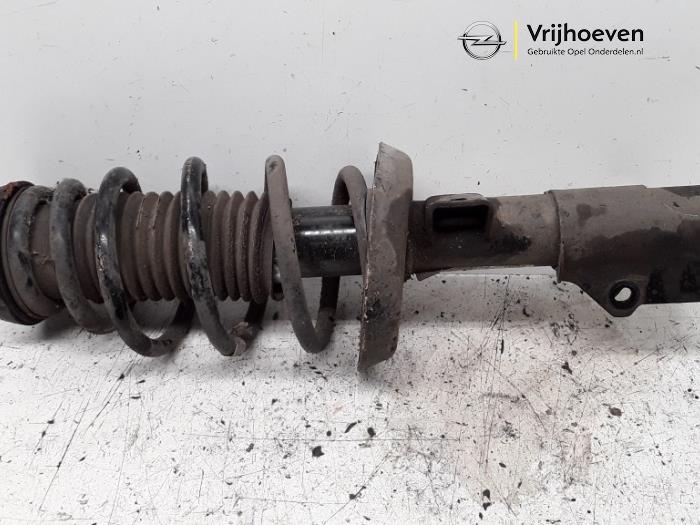 Fronts shock absorber, left from a Opel Astra J Sports Tourer (PD8/PE8/PF8) 2.0 CDTI 16V 160 2011