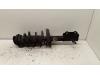 Fronts shock absorber, left from a Opel Astra J Sports Tourer (PD8/PE8/PF8) 1.3 CDTI 16V ecoFlex 2013