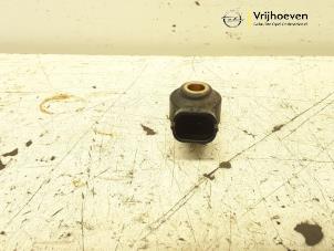 Klopfsensor van een Opel Corsa D 1.4 16V Twinport 2007