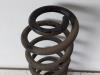 Rear coil spring from a Opel Astra K 1.4 Turbo 16V 2017