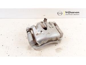 Used Front brake calliper, left Opel Karl 1.0 12V Price € 30,00 Margin scheme offered by Autodemontage Vrijhoeven B.V.