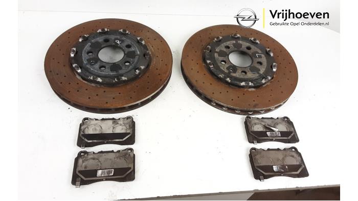 Brake disc + block front from a Opel Astra J GTC (PD2/PF2) 2.0 16V Turbo OPC 2014