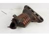 Exhaust manifold + catalyst from a Opel Astra H (L48) 1.4 16V Twinport 2008