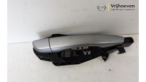 Used Rear door handle 4-door, right Opel Corsa F (UB/UH/UP) 1.2 Turbo 12V 130 Price € 40,00 Margin scheme offered by Autodemontage Vrijhoeven B.V.