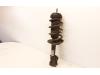 Fronts shock absorber, left from a Opel Corsa E 1.4 16V 2018