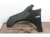 Front wing, left from a Opel Astra J Sports Tourer (PD8/PE8/PF8) 1.3 CDTI 16V ecoFlex 2012