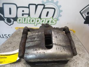 Used Front brake calliper, left Volkswagen Golf VII (AUA) 1.6 TDI 16V Price on request offered by DeVo Autoparts