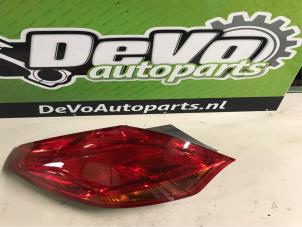 Used Taillight, left Opel Astra J (PC6/PD6/PE6/PF6) 1.4 16V ecoFLEX Price on request offered by DeVo Autoparts