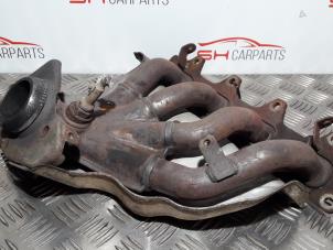 Used Exhaust manifold Renault Clio III (BR/CR) 1.4 16V Price € 39,00 Margin scheme offered by SH Carparts