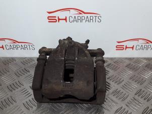 Used Front brake calliper, left Nissan Micra (K12) 1.0 16V Price € 22,00 Margin scheme offered by SH Carparts